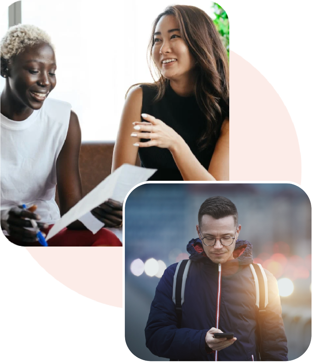 two women talking and man looking down at phone